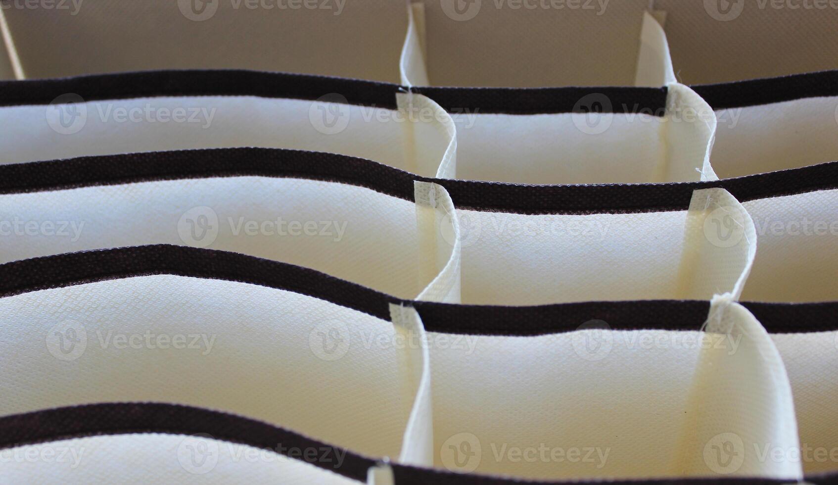Colorful curved fabric linen drawer compartments photo