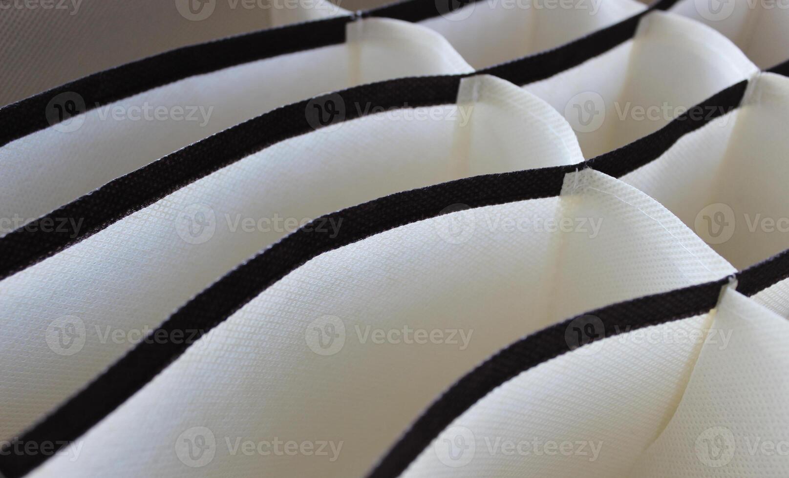 Textured background of contrast monochrome fabric cells photo