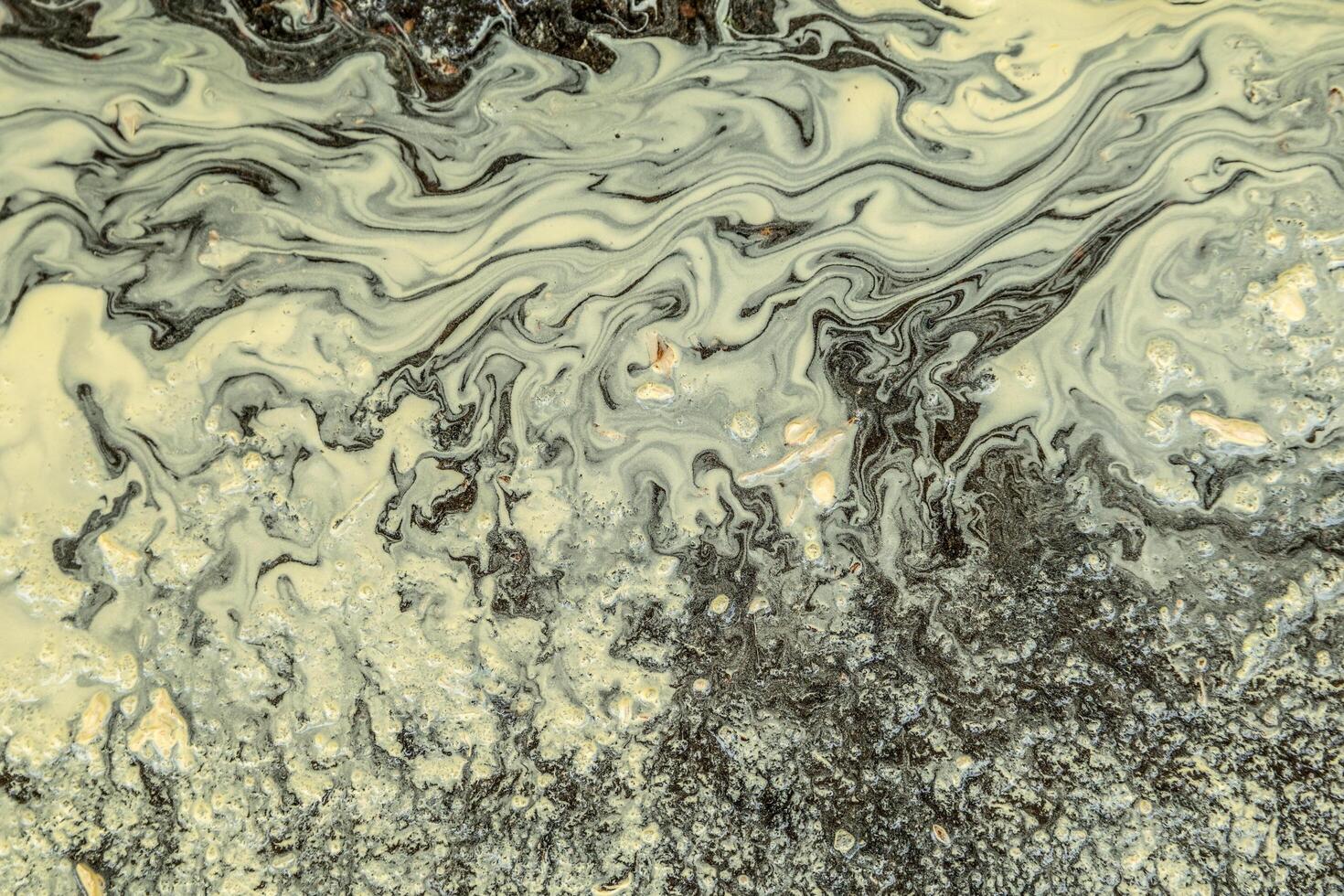 Pollen in a puddle abstract photo