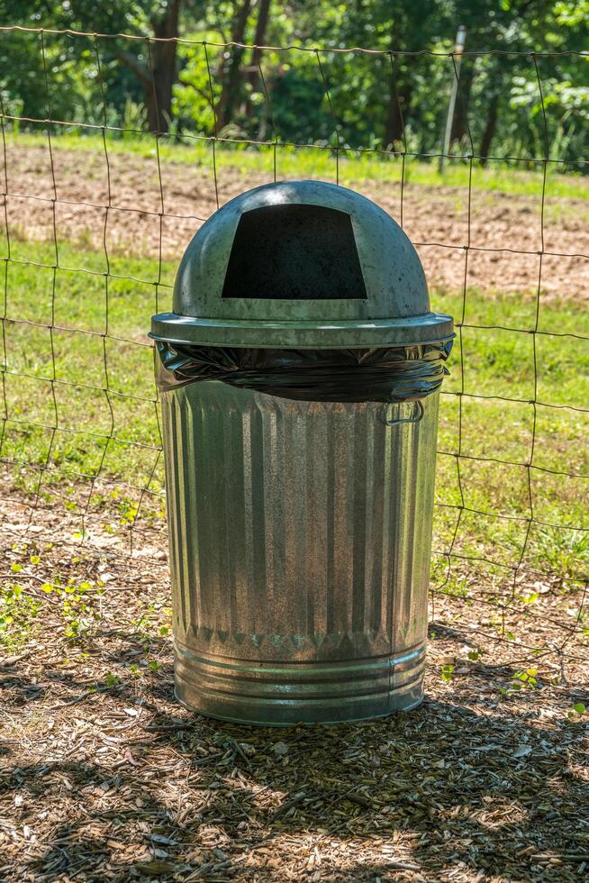 Metal garbage can with lid photo