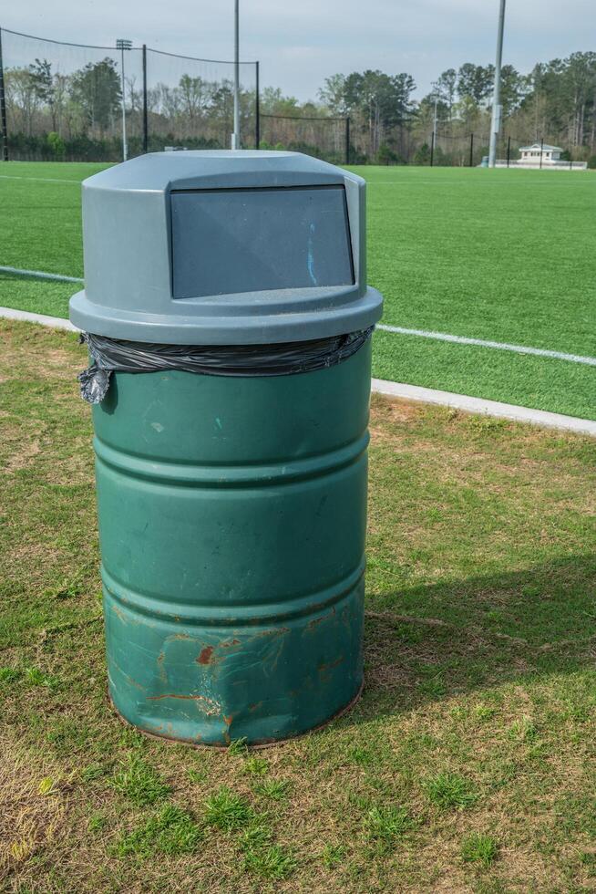 Garbage can in a park photo