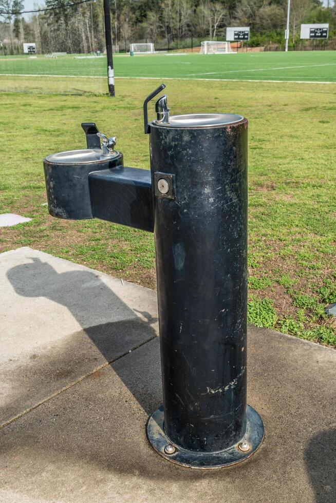 Drinking water fountain in the park photo