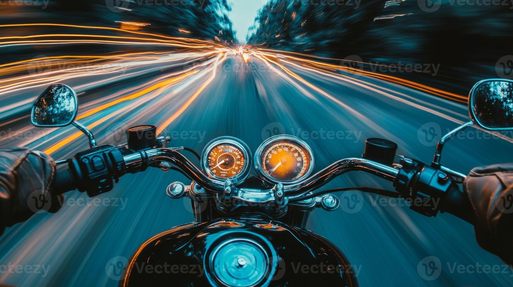 Motorcyclist driving fast at night with motion blur effect photo