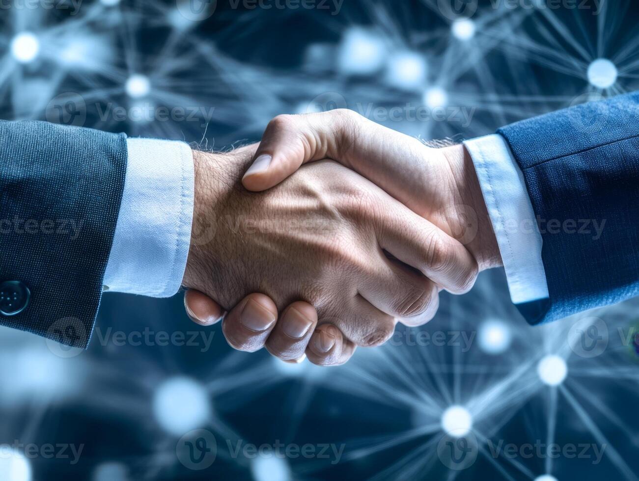 Businessmen shaking hands with network connection in background photo