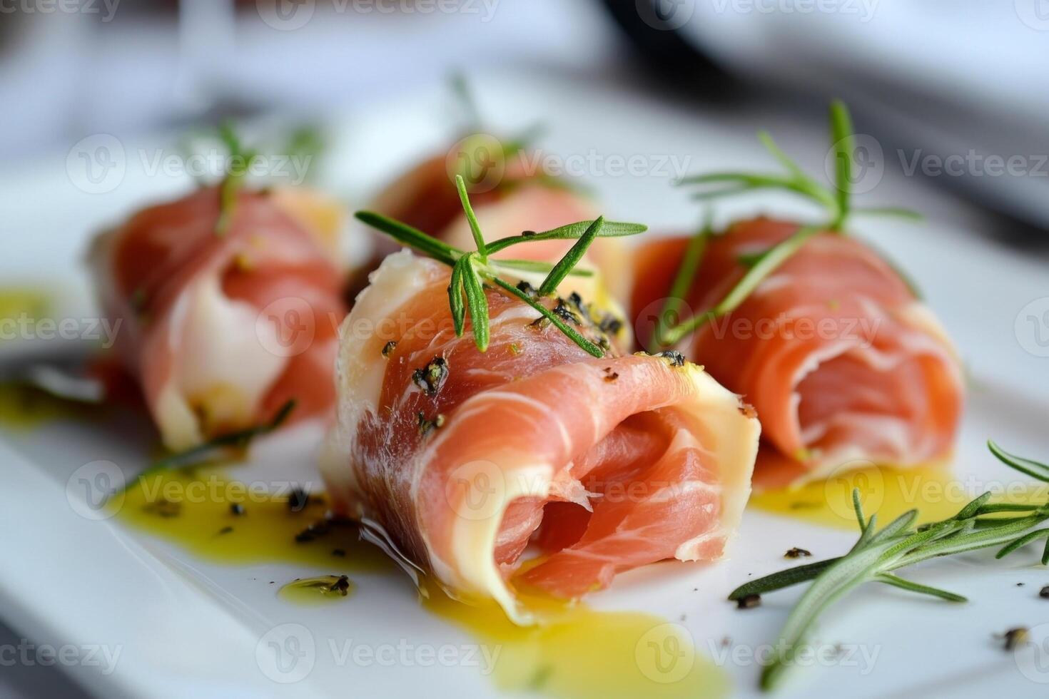 Delicious appetizer of rolled prosciutto with rosemary and spices photo