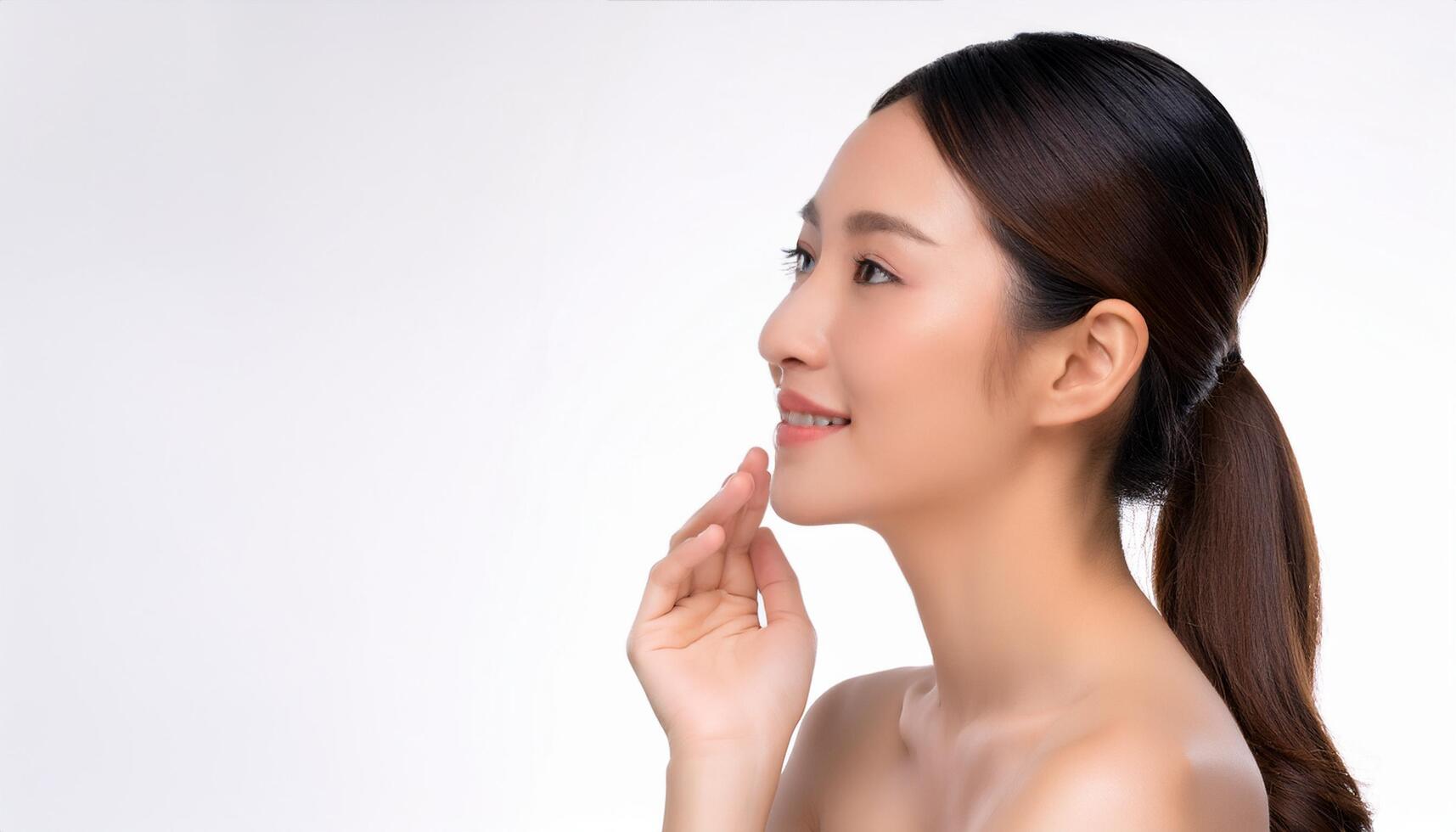 Portrait of a beautiful young Asian woman with flawless, radiant skin, posing gracefully against a clean white background, cosmetic, wellness, skincare, beauty, and natural health, care branding photo
