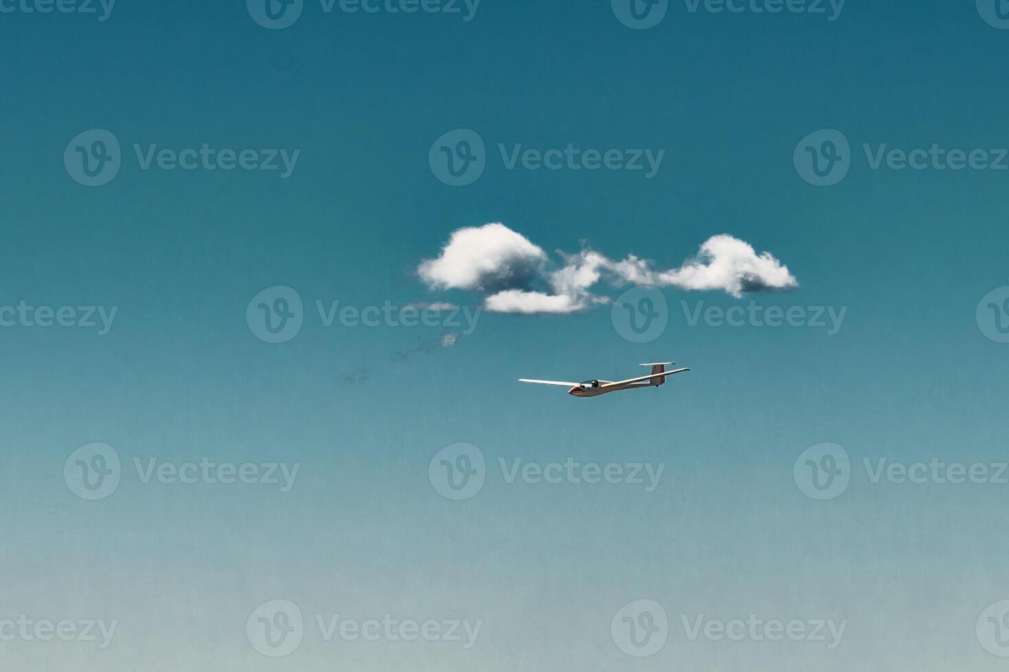 A glider flies in the sky photo