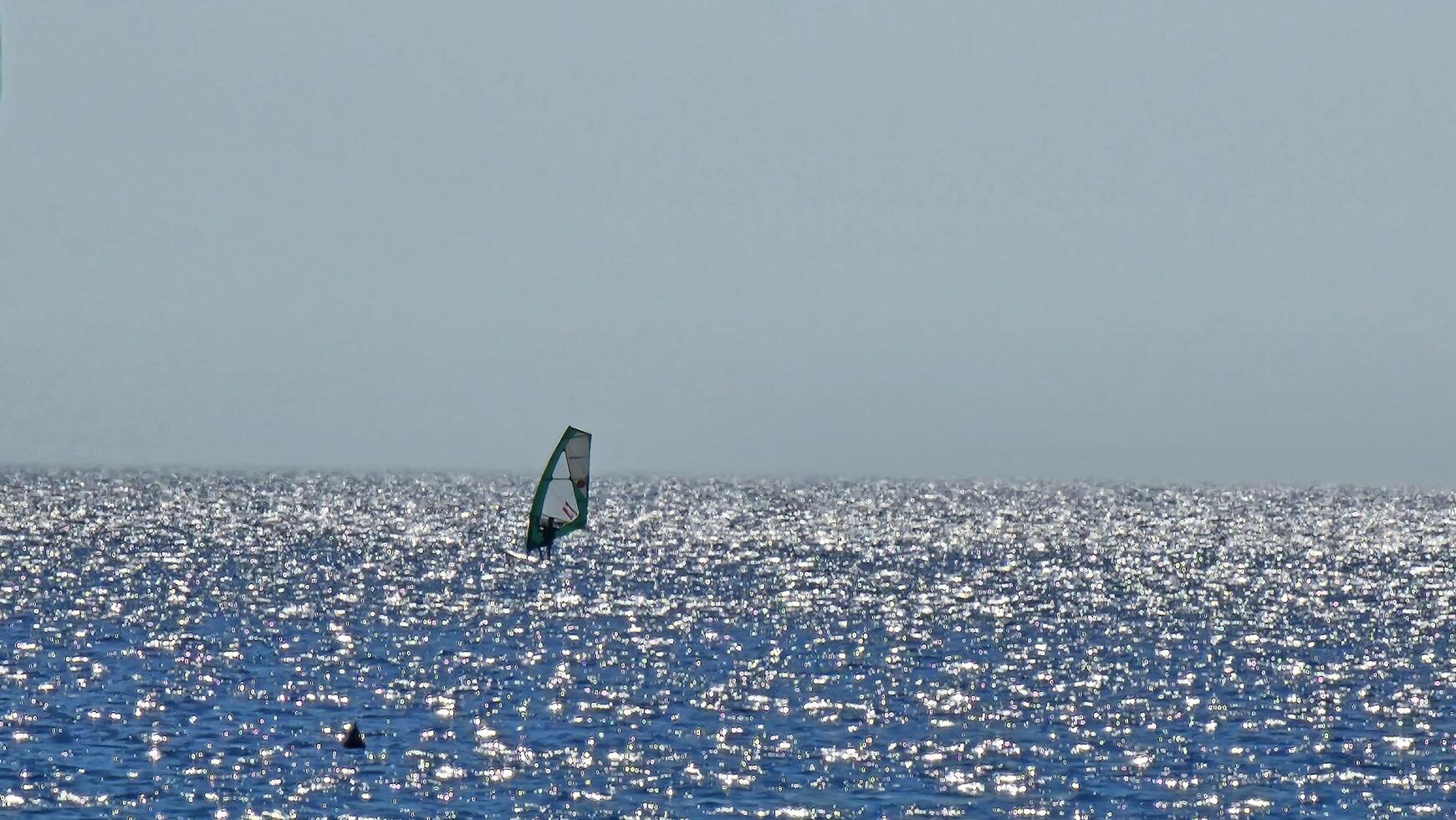 coastal landscapes with the beach and the sparkle of the sea during summer days photo