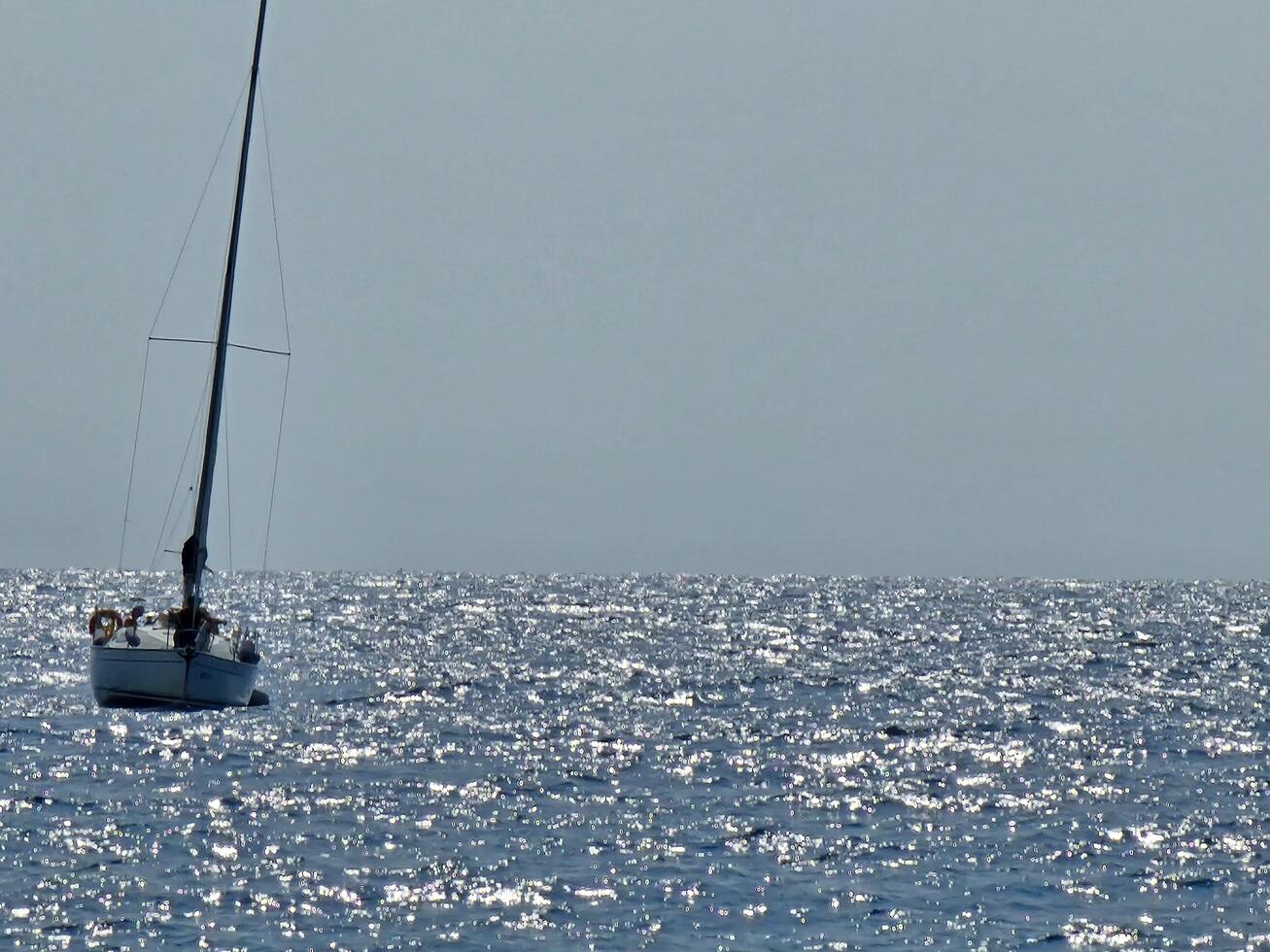 coastal landscapes with the beach and the sparkle of the sea during summer days photo