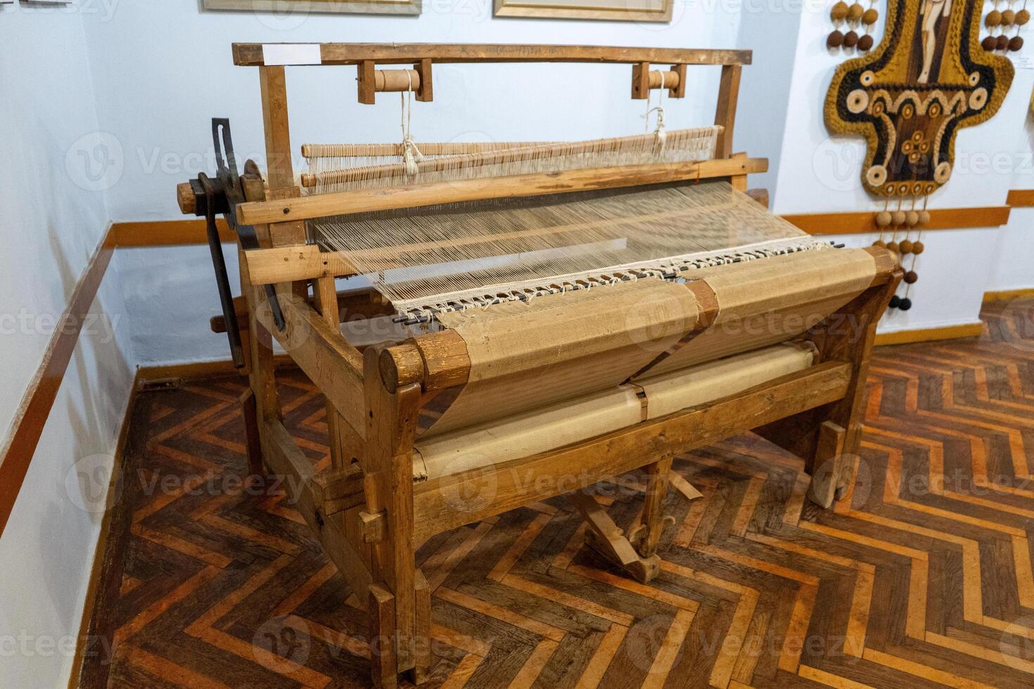 Wooden loom. Weaving machine photo