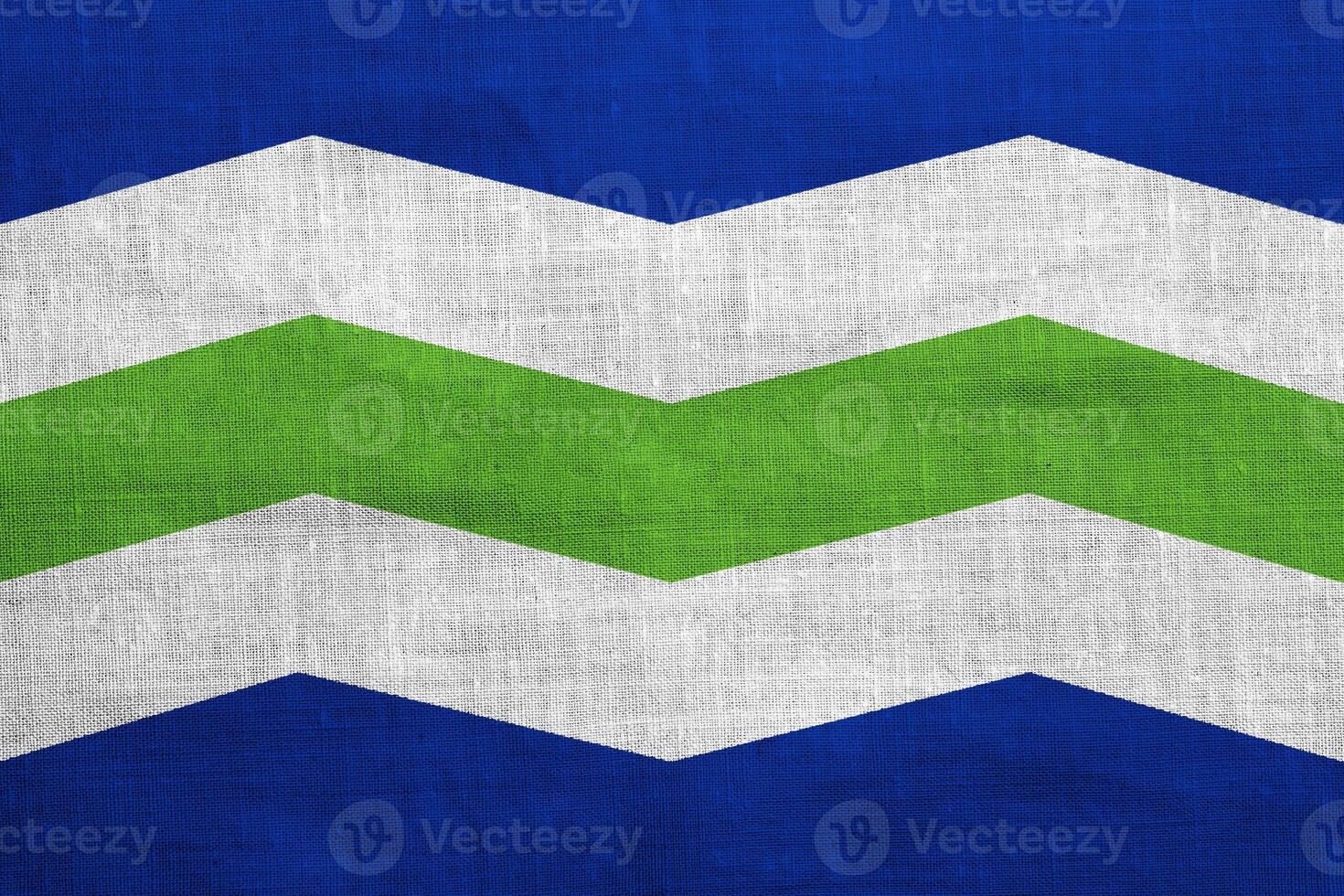 Flag of the city of Burlington, Vermont, USA, on a background of fabric texture. Conceptual collage photo