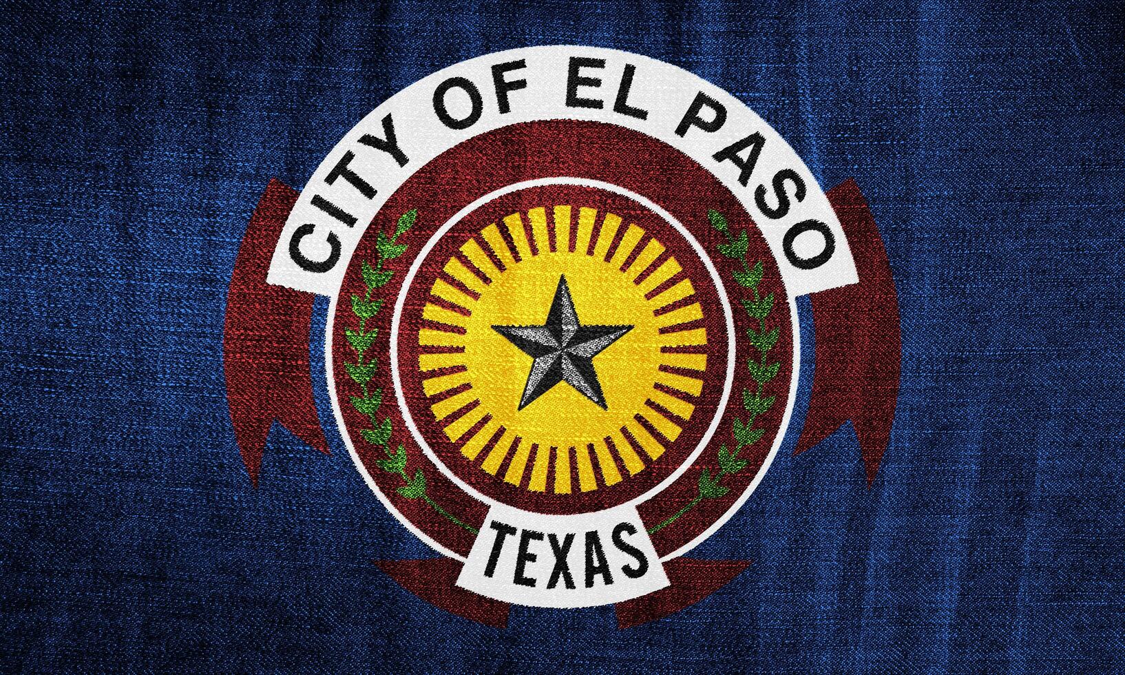 Flag of the city of El Paso, Texas, USA, on a background of fabric texture. Conceptual collage photo