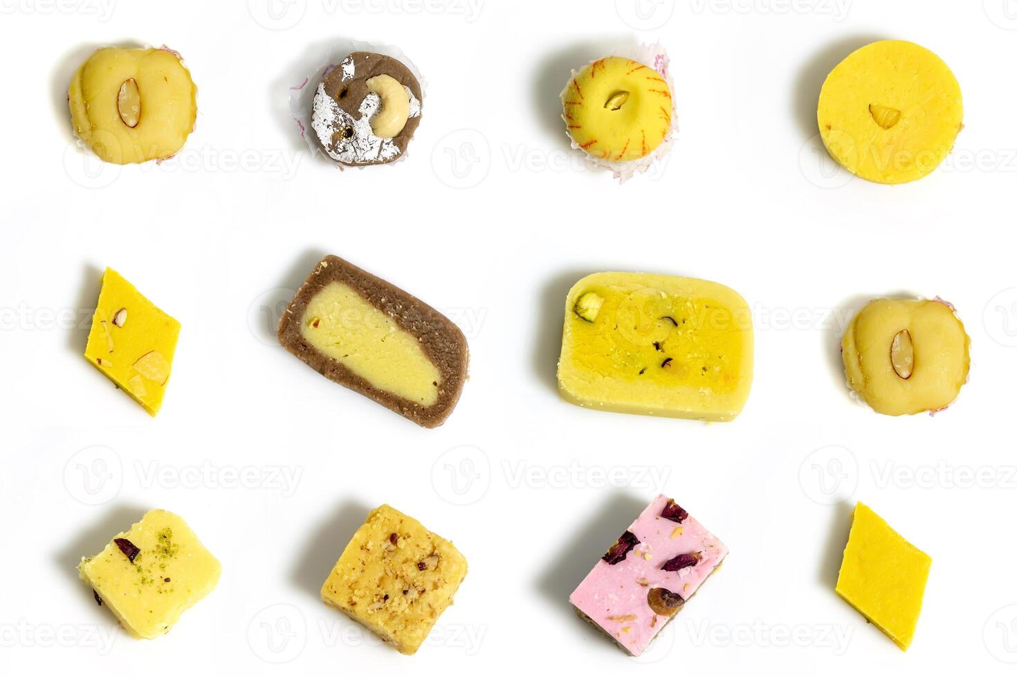 Indian sweets. Set of delicious Indian sweets isolated on white background. Top view photo