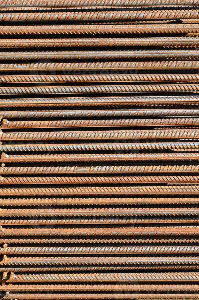 a pile of steel bars stacked together photo