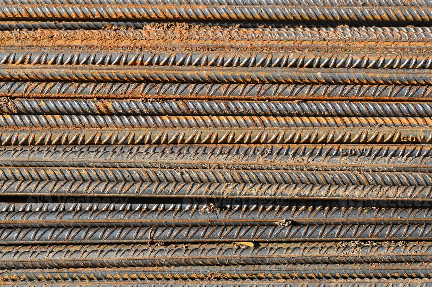 a pile of steel bars stacked together photo