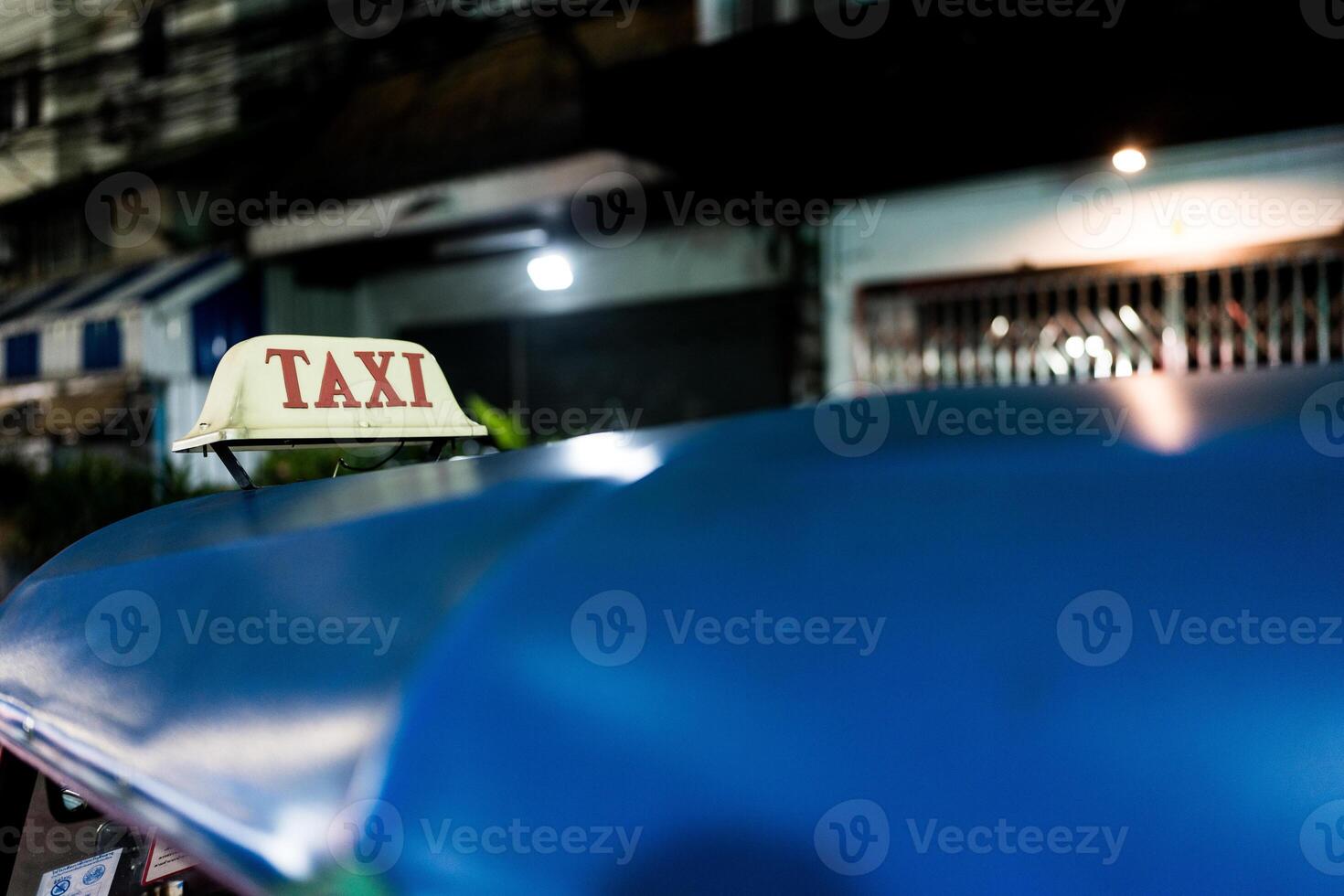 Thailand three wheel native taxi. Close up of text of TAXI on car roof, Thailand Tuk Tuk photo