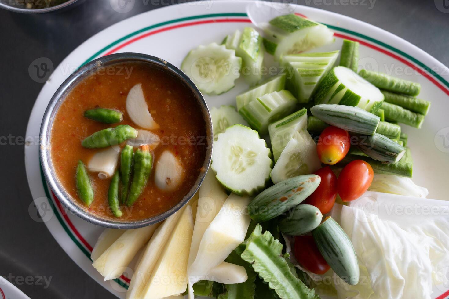 Crab egg chili paste served with many fresh vegetables photo