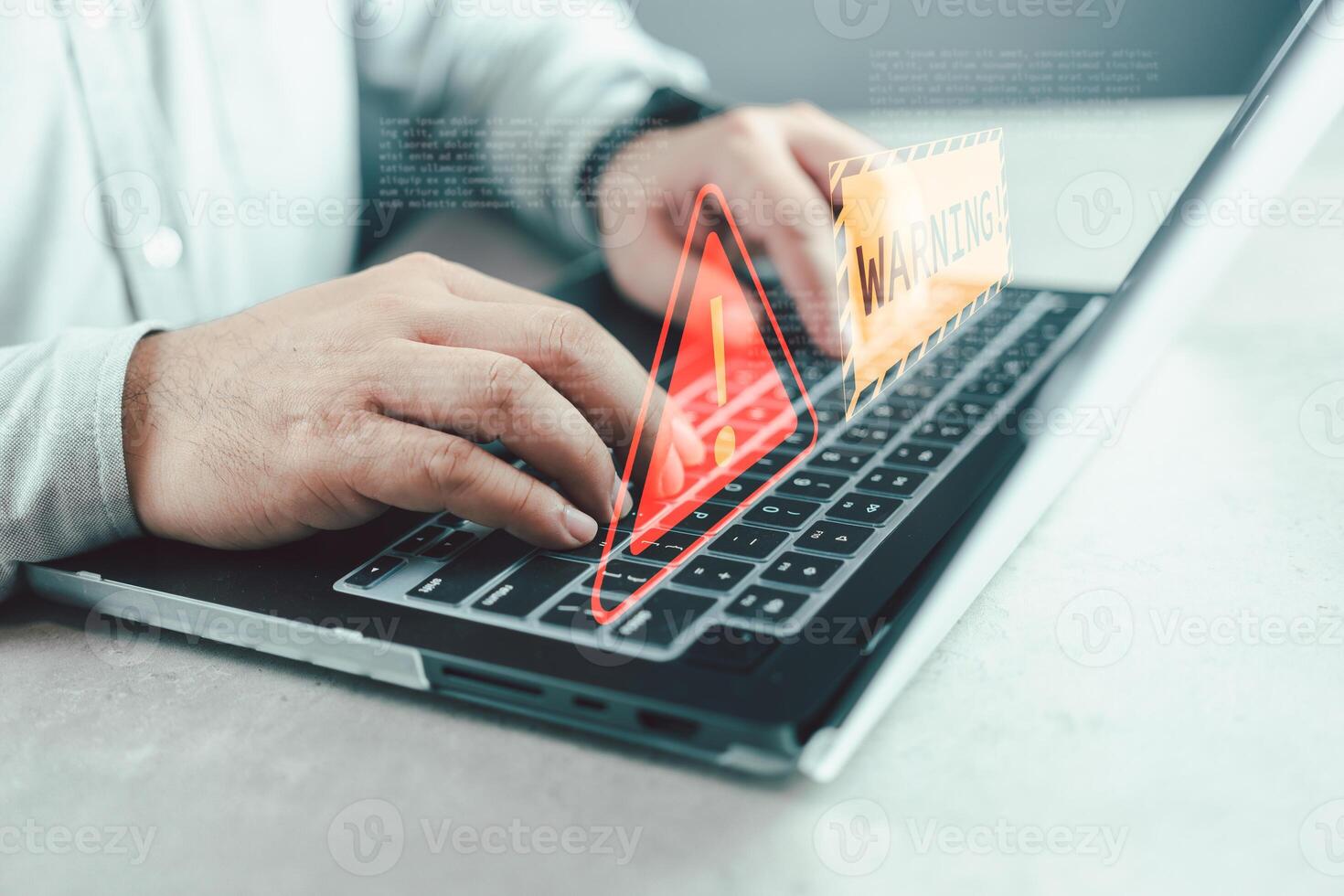 Businessman programmer, developer using laptop computer with triangle caution warning sign. photo