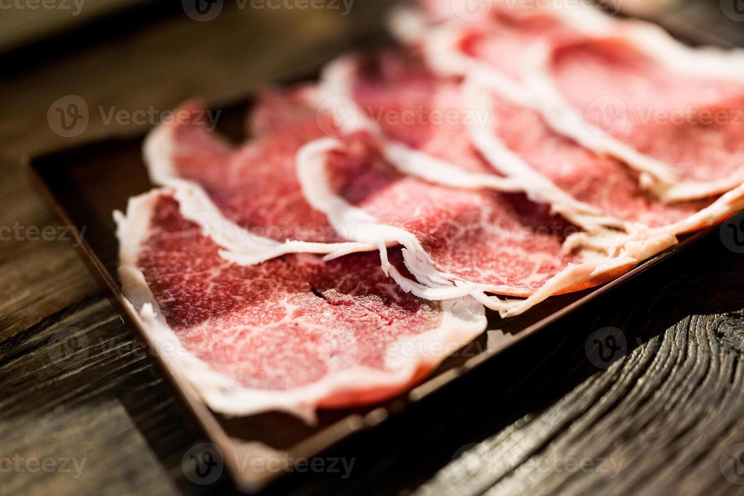 Sliced beef with fatty. Quality beef on tray for hotpot. photo