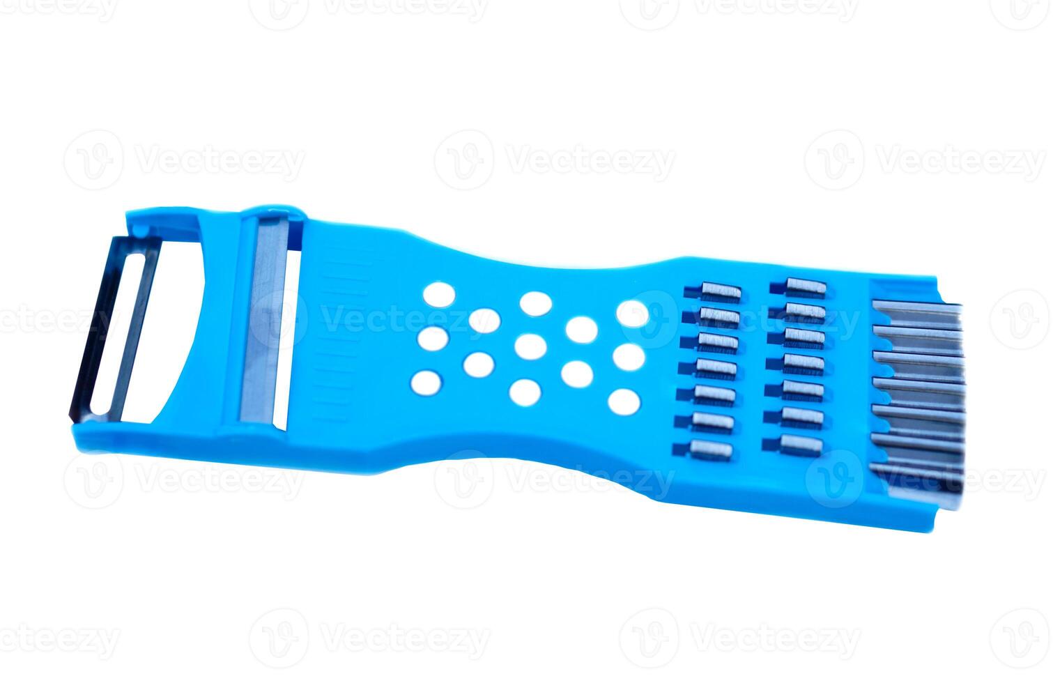 Blue multi purpose vegetable or cheese slicer, isolated on white background. Concept, kitchen utensil. Tool or equipment for cookery. Making cooking easier and convenient. photo