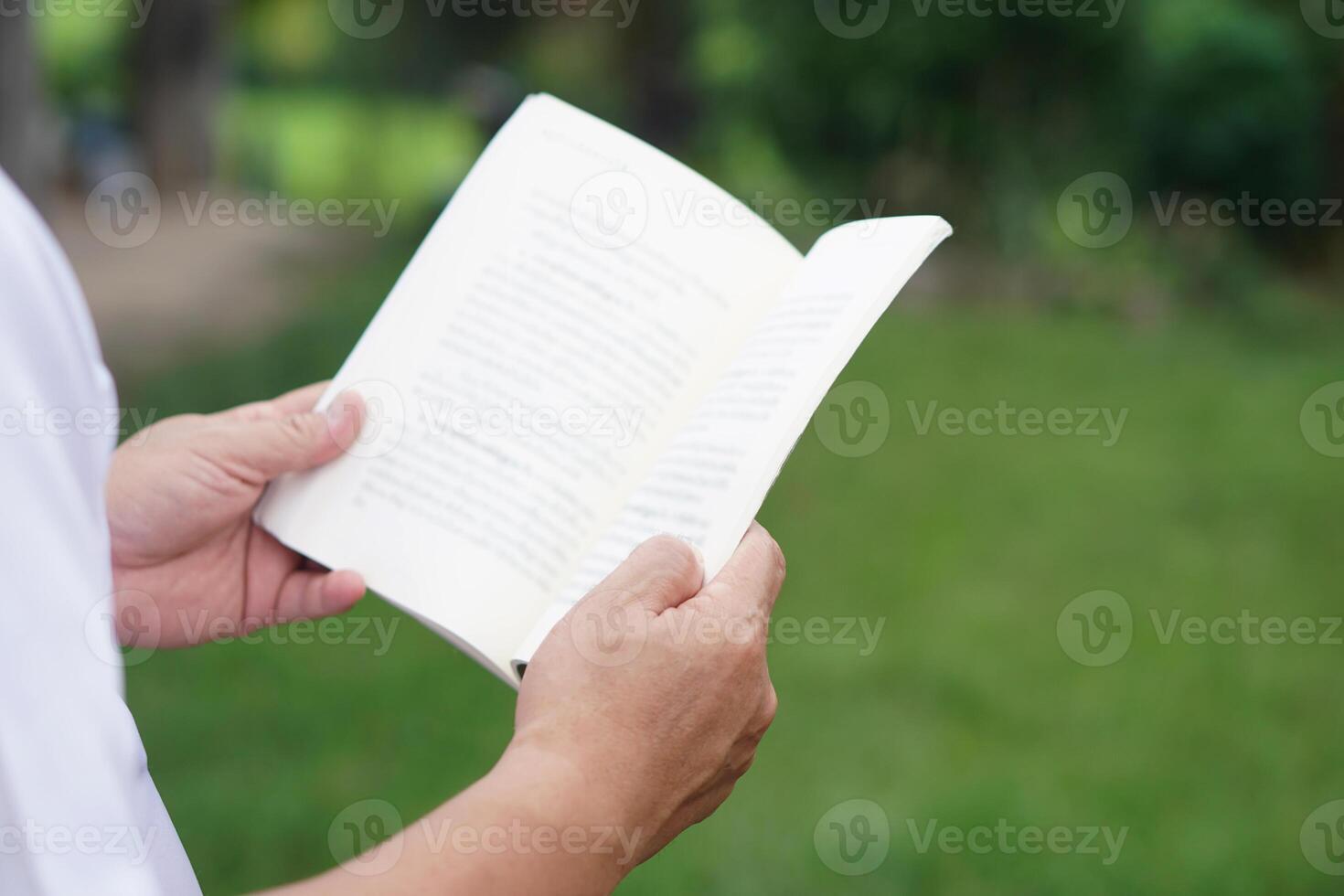 Close up man is reading book. Concept, self study, reading book for knowledge, pleasure or self development to apply knowledge in daily life living. Read for preparing exam. photo