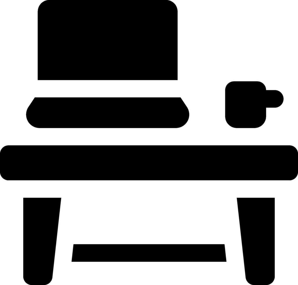 A black and white icon of a desk and laptop vector