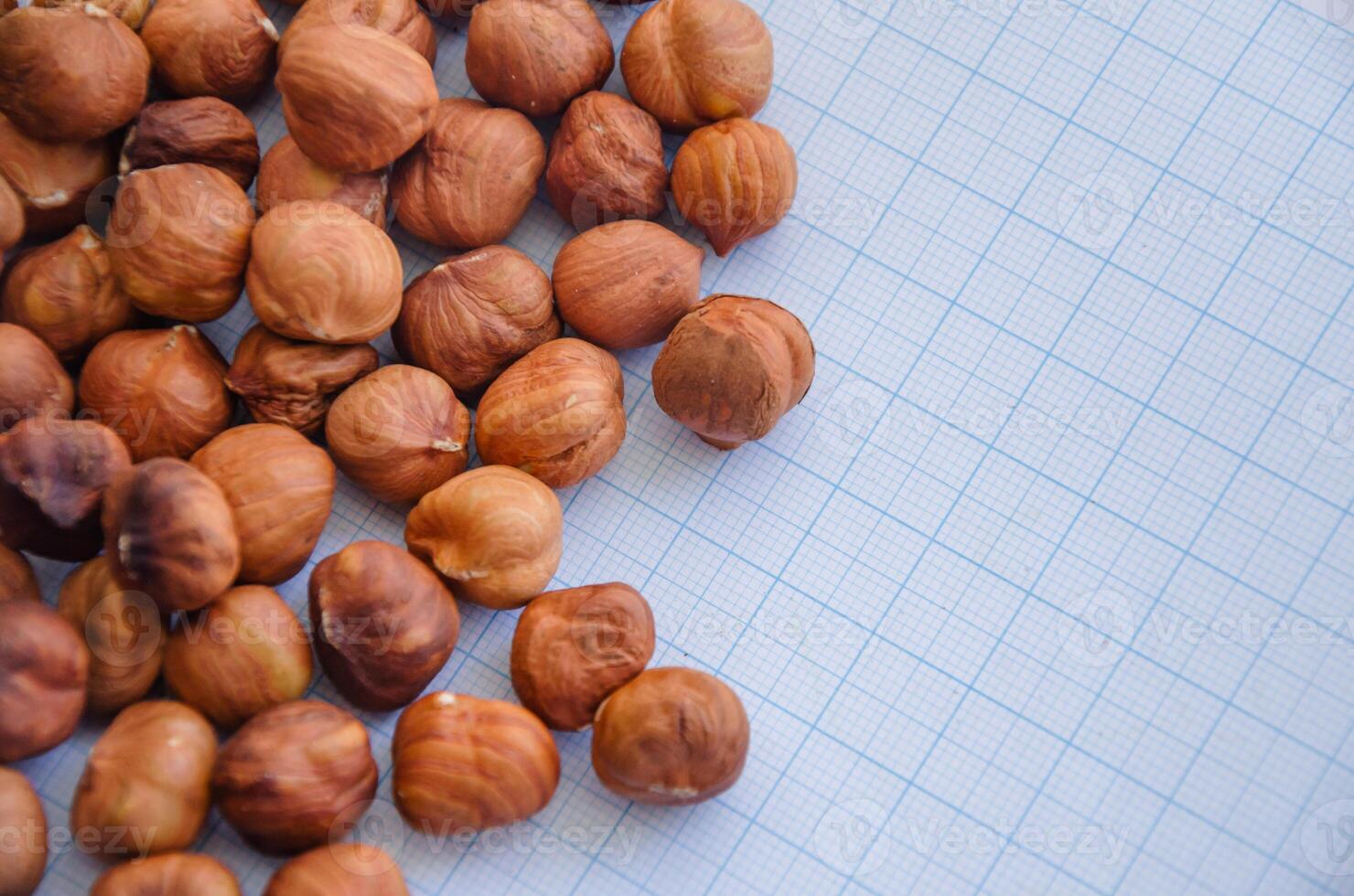 hazelnuts without shell on a light background in a check photo