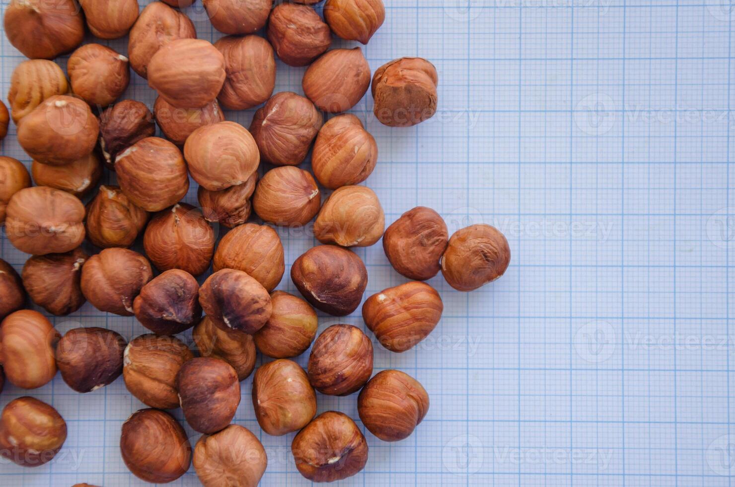 hazelnuts without shell on a light background in a check photo