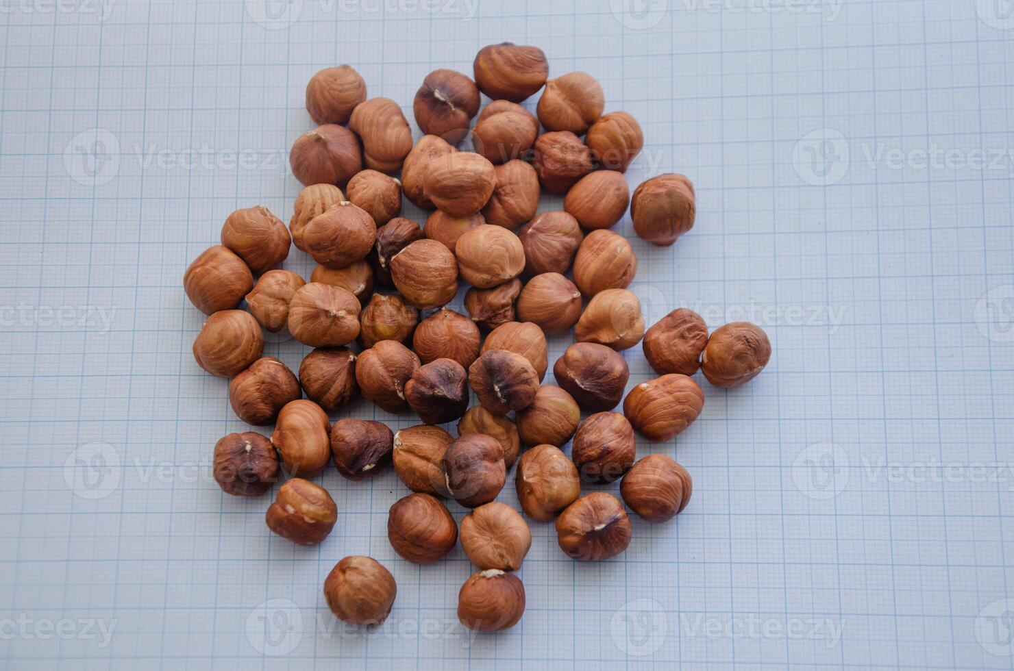 hazelnuts without shell on a light background in a check photo