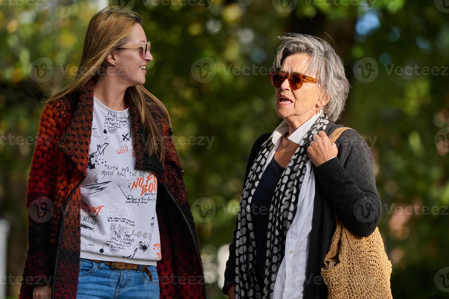 Autumn Walk. A Mother and Daughter Share Love and Support in Natures Embrace. photo