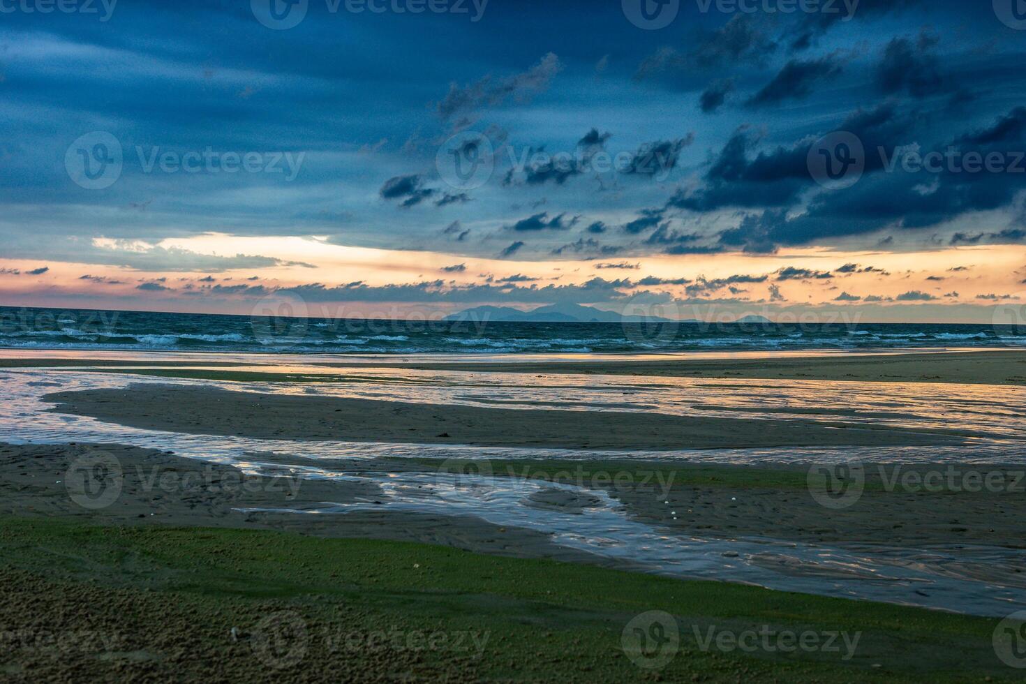 Beach with beautiful rain clouds photo