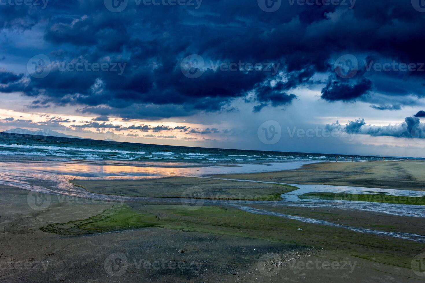 Beach with beautiful rain clouds photo