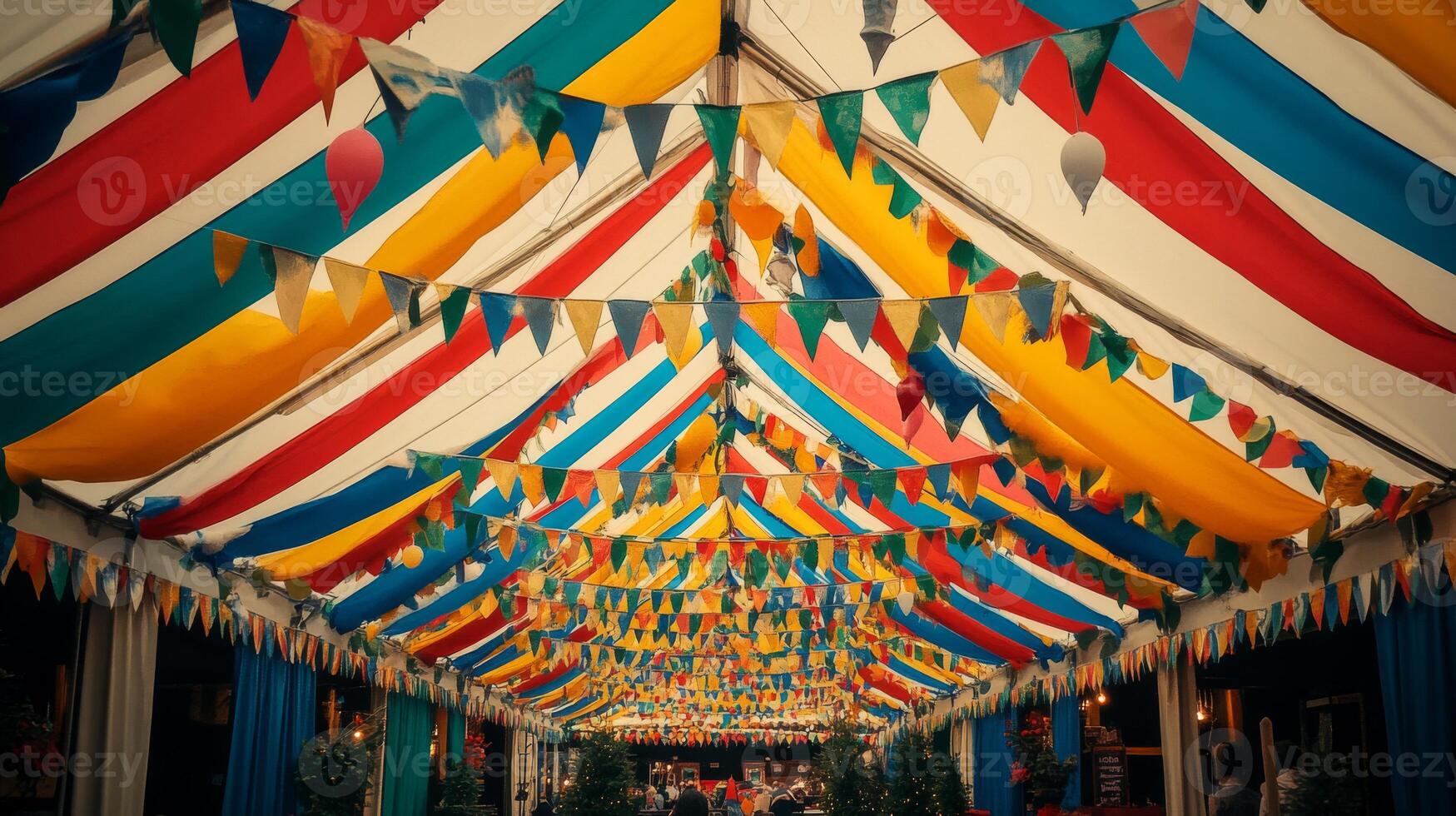 A colorful tent with bunting and flags photo