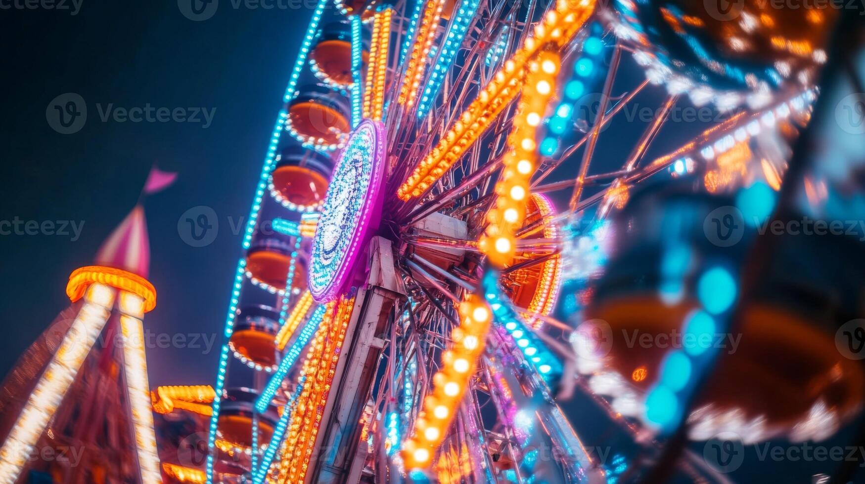 A ferris wheel at night with colorful lights photo