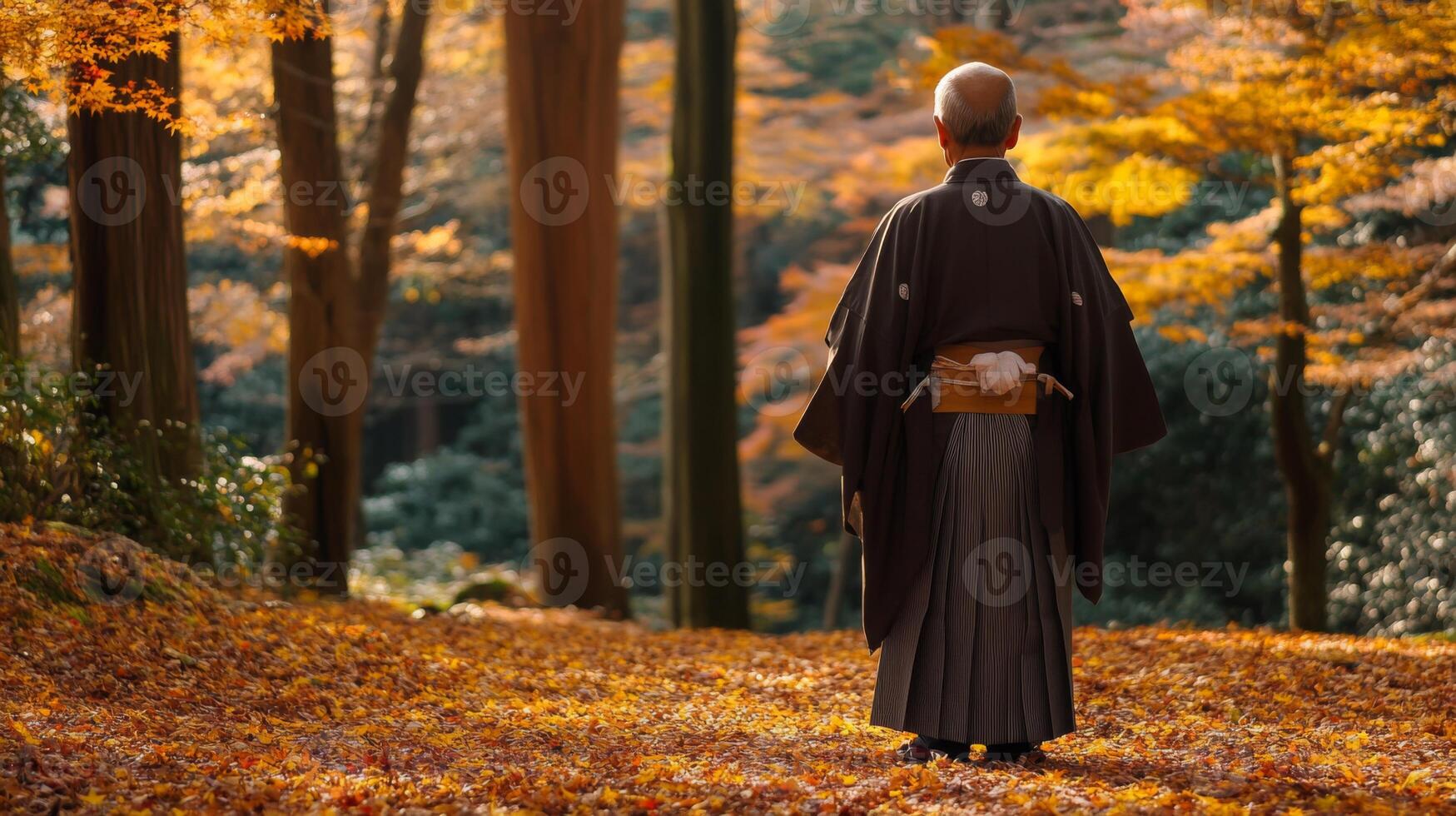 Man in Traditional Japanese Clothing Amidst Autumn Foliage photo