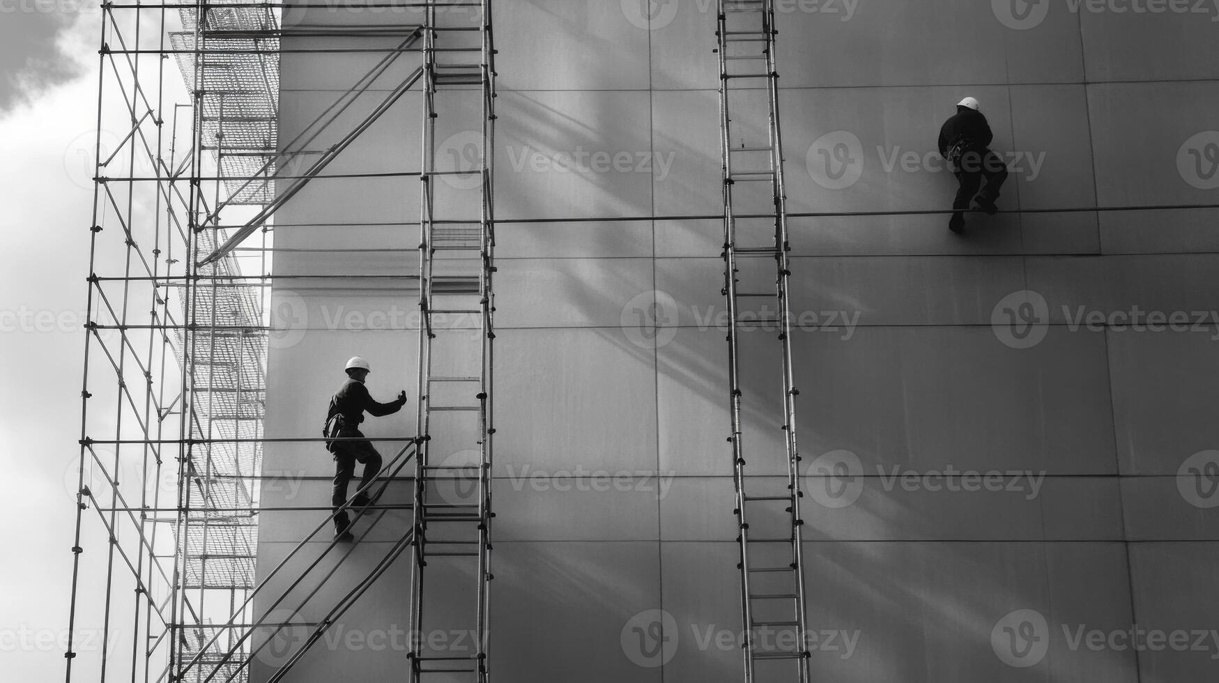 Construction Workers on Scaffolding on a Building photo