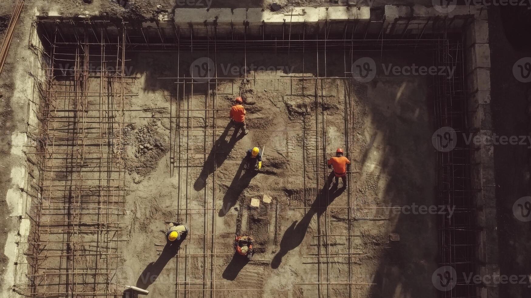 Construction Workers Working on a Rebar Grid photo
