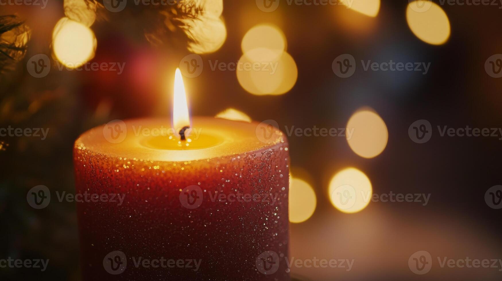 A Single Lit Candle With a Red Glittery Body Surrounded by Warm Bokeh Lights photo