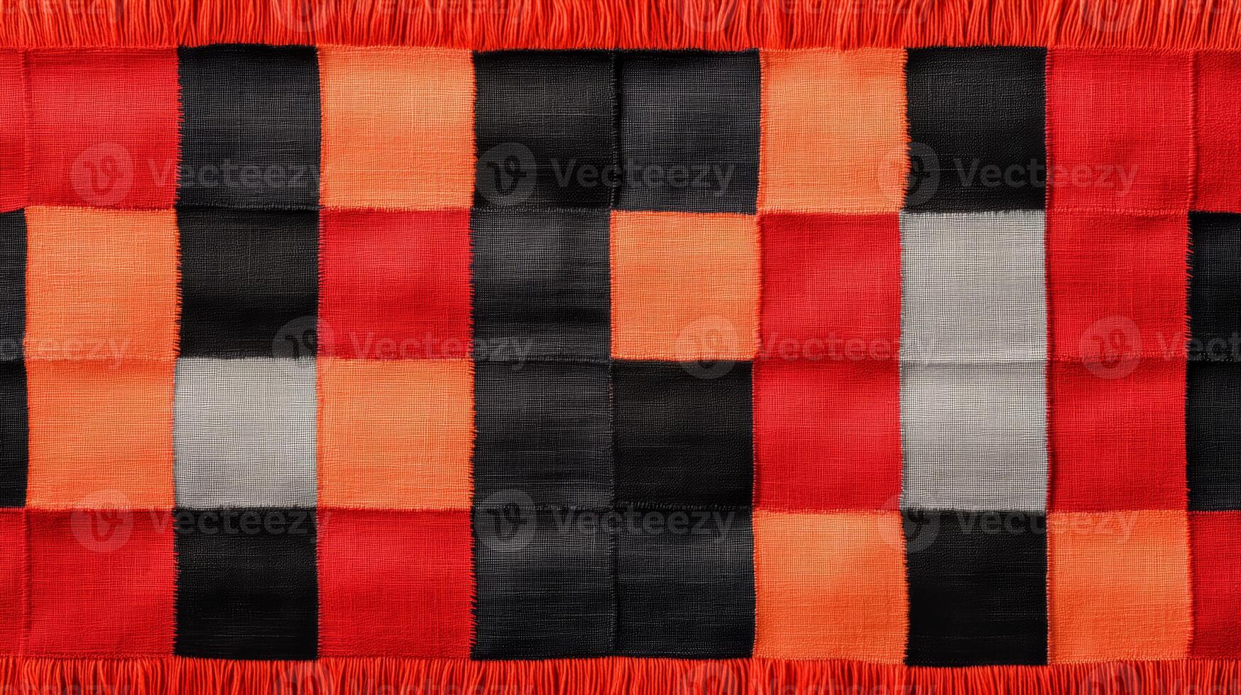 A red, black and grey striped blanket with fringes photo