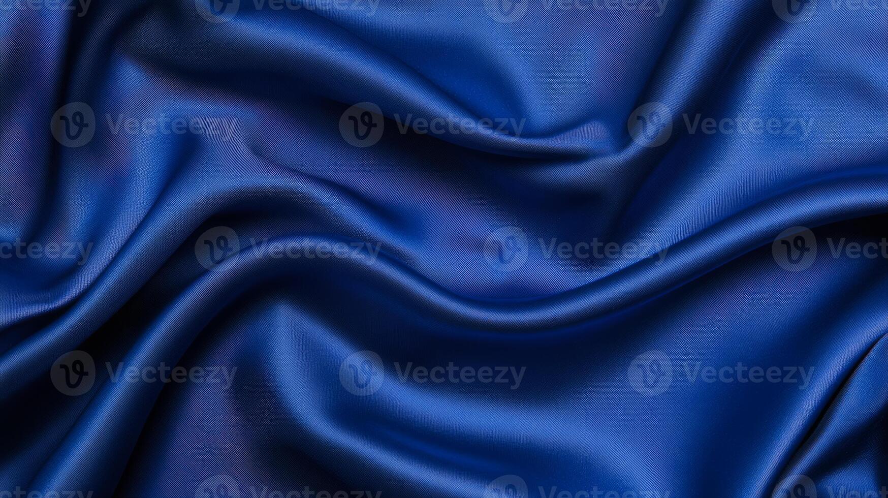 Soft royal blue velvet with flowing folds and a touch of silver luxurious abstract background ideal for New Years Eve themes elegant and festive texture photo