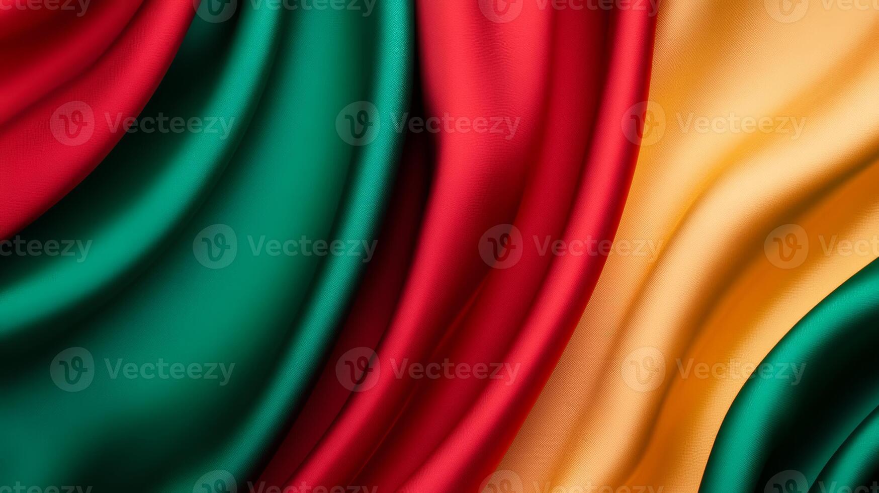 Vibrant red green and yellow silk with flowing curves and bright highlights abstract background ideal for Kwanzaa festive and culturally rich design photo