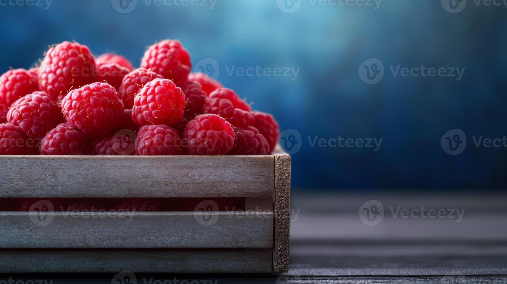 Bright red raspberries with a soft texture in a small wooden crate market stall background photo