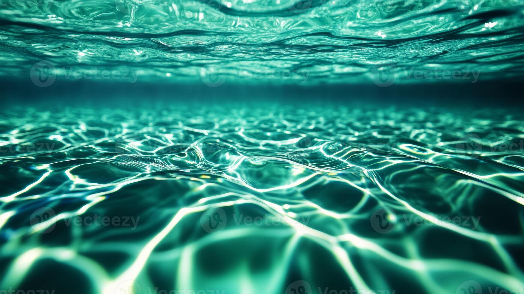 Close up of liquid waves with iridescent shades of green and blue merging underwater photo