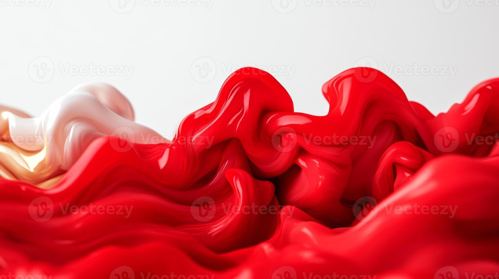 Extreme close up of red and gold liquid ink waves blending in water forming abstract shapes photo