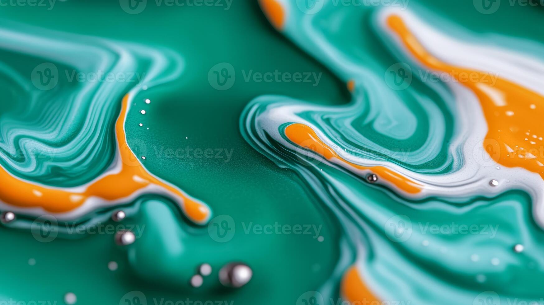 Macro image of liquid paint waves mixing turquoise and orange with marbled patterns photo