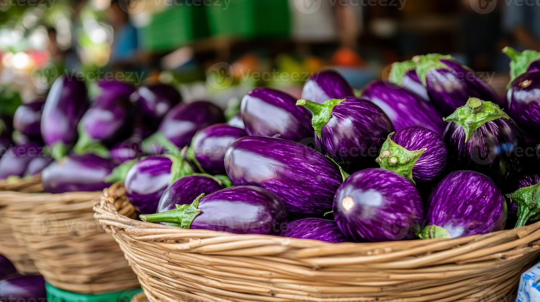 A basket full of purple eggplant sitting on a table photo