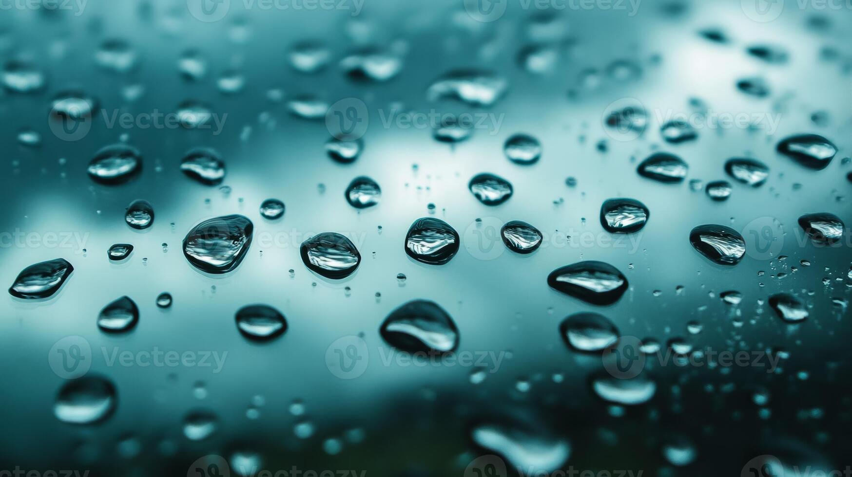Heavy raindrops on glass with dark storm clouds in the background photo