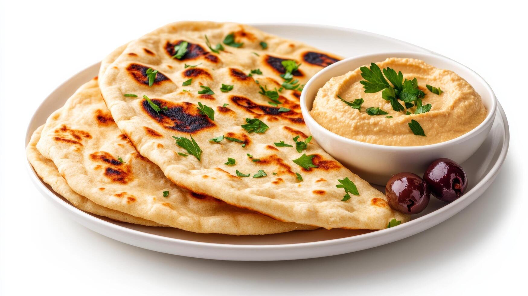 Flatbreads with hummus dip on white background photo