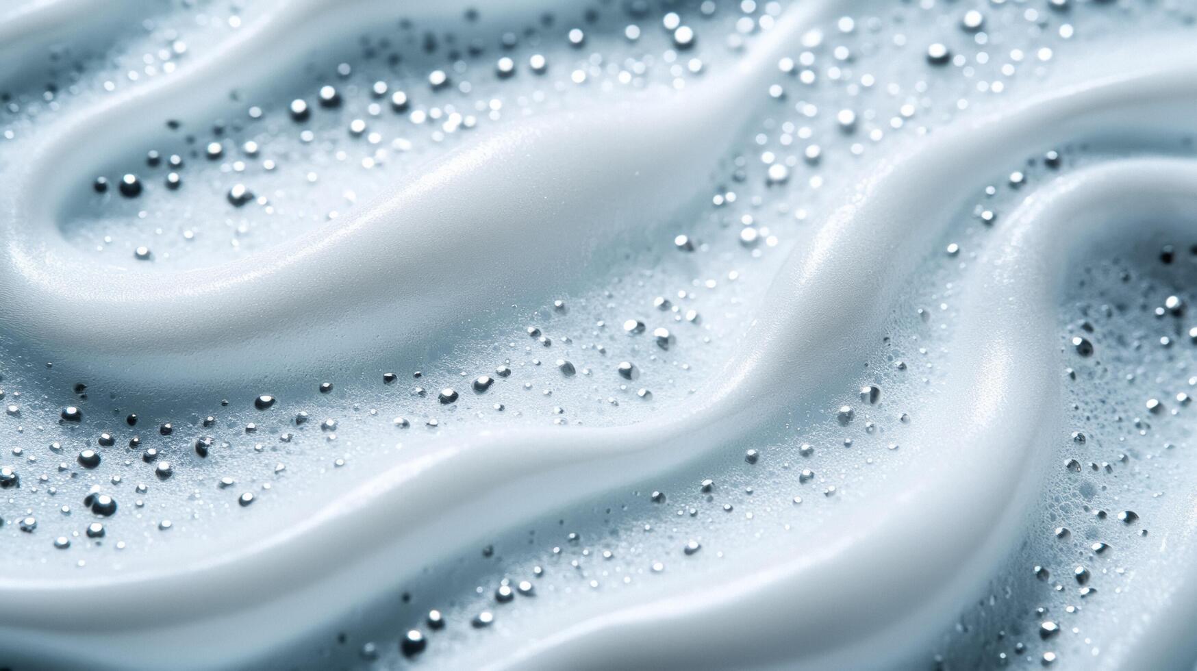 Closeup of a creamy misty white moisturizer with tiny reflective particles evoking the look of snow crystals photo
