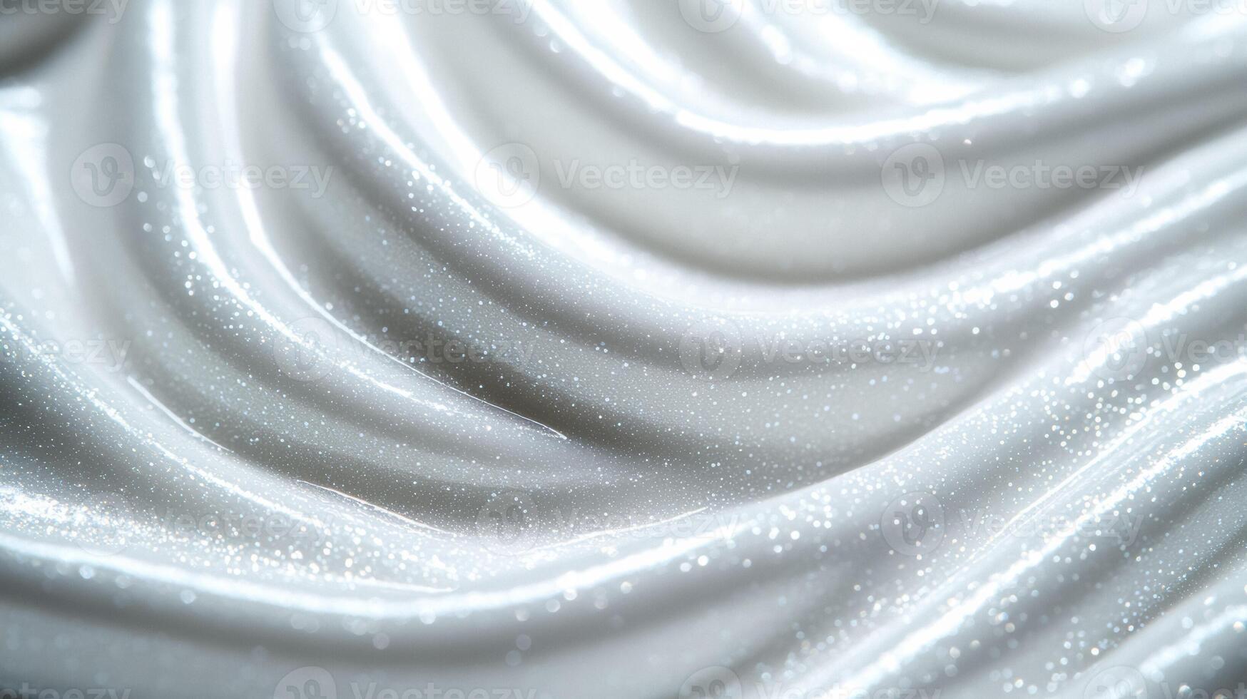 Closeup of a creamy snow white serum with tiny iridescent flakes resembling a glistening winter frost photo